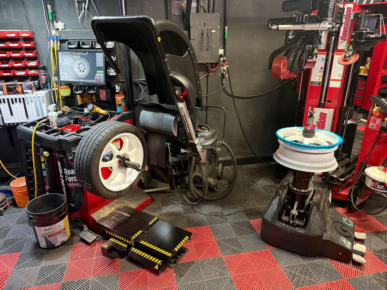 White alloy wheels on the Hunter balancer and Hunter Revolution tire changer