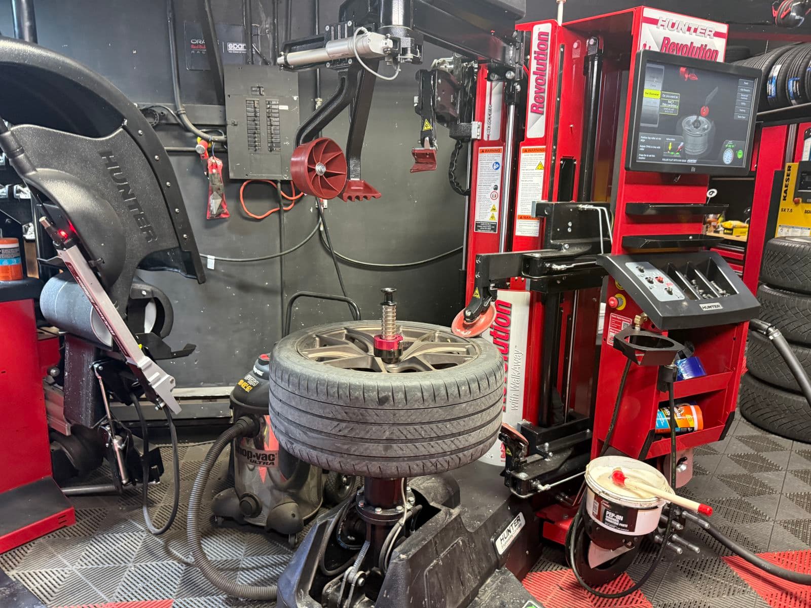 Low-profile tire on a bronze wheel on the Hunter Revolution tire changer