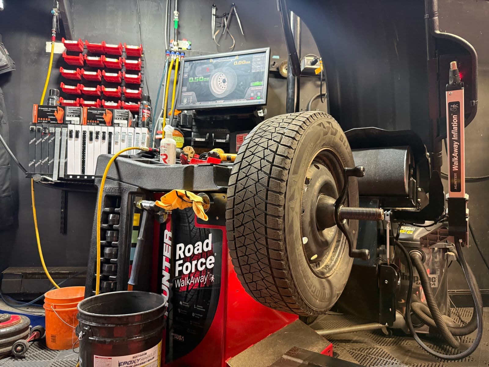 Winter tire on a steel wheel on the Hunter Road Force WalkAway balancer