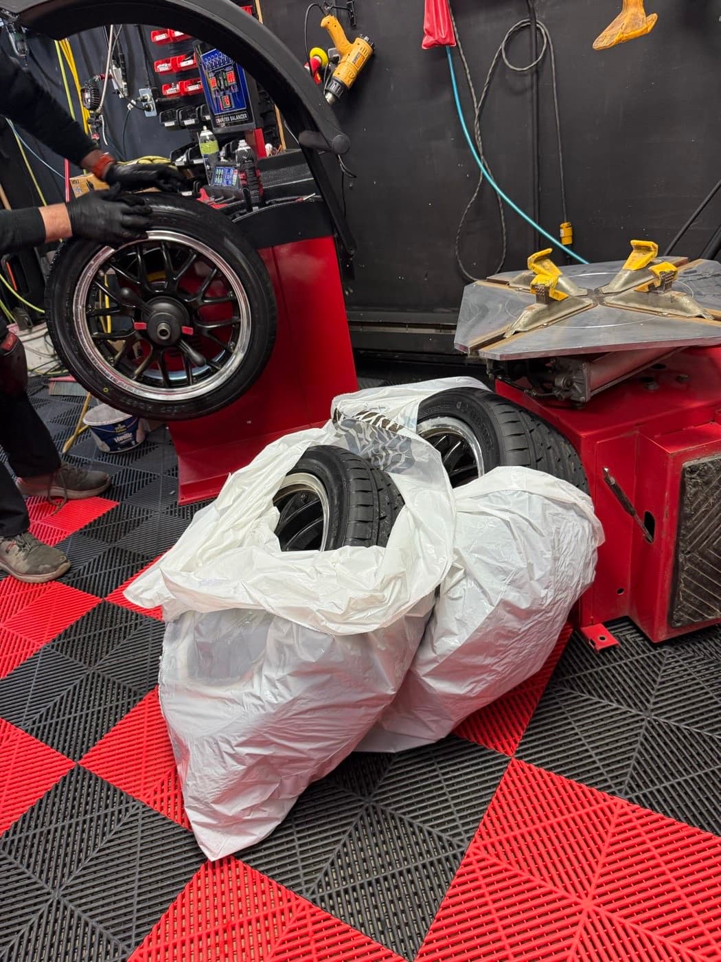Off-season tires sealed in storage bags, packed for the customer to take home