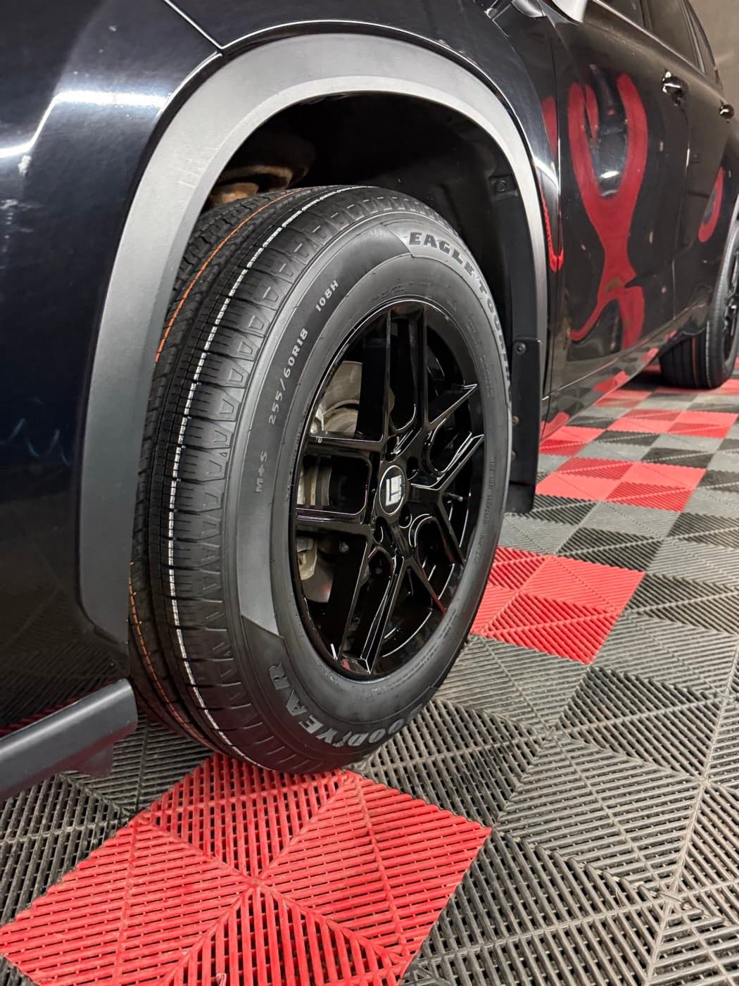 Goodyear Eagle sidewall with the size marking 255/60R18 108H visible