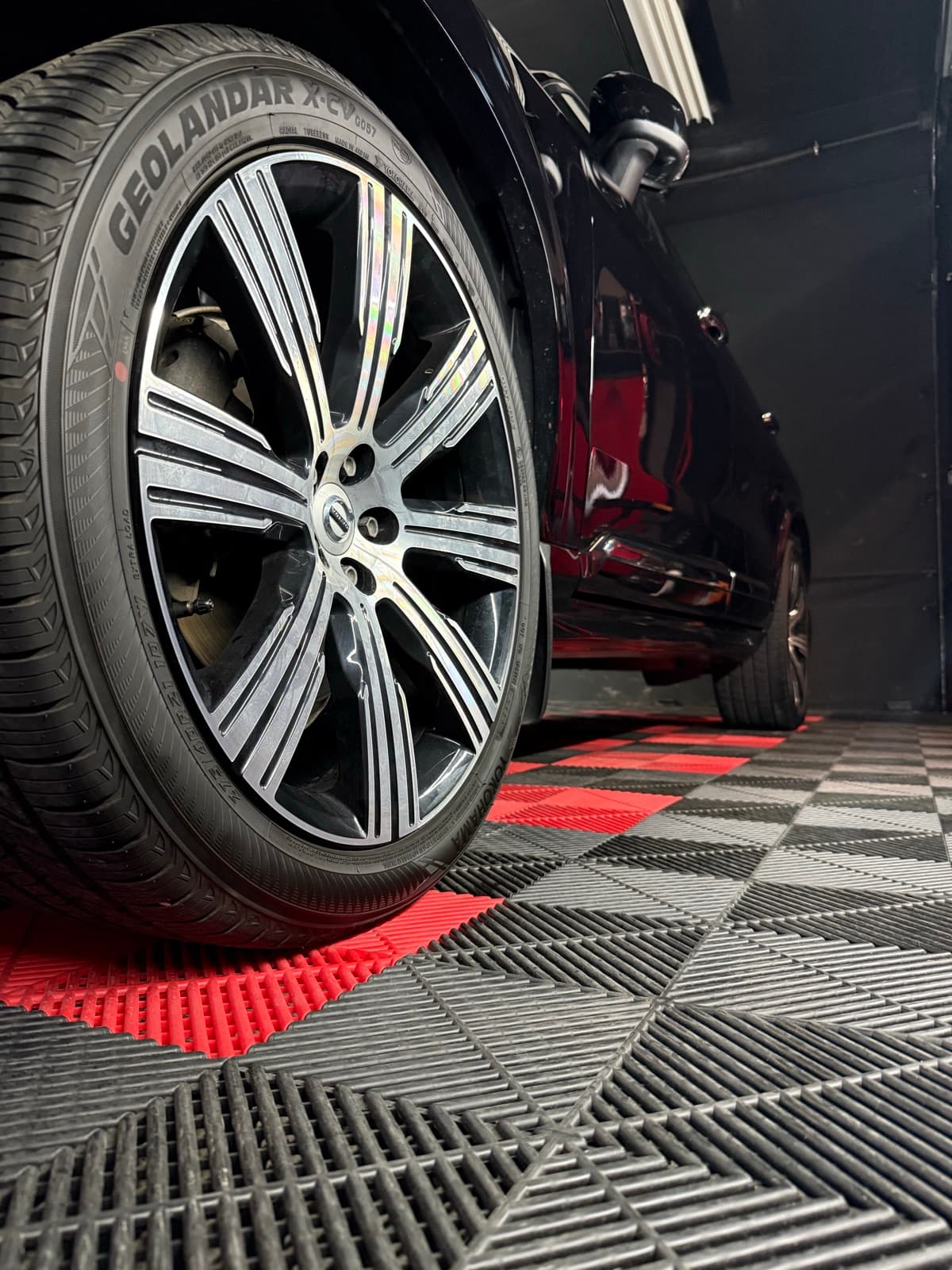 Freshly installed Yokohama Geolandar tire on a black SUV at PitStop & Go