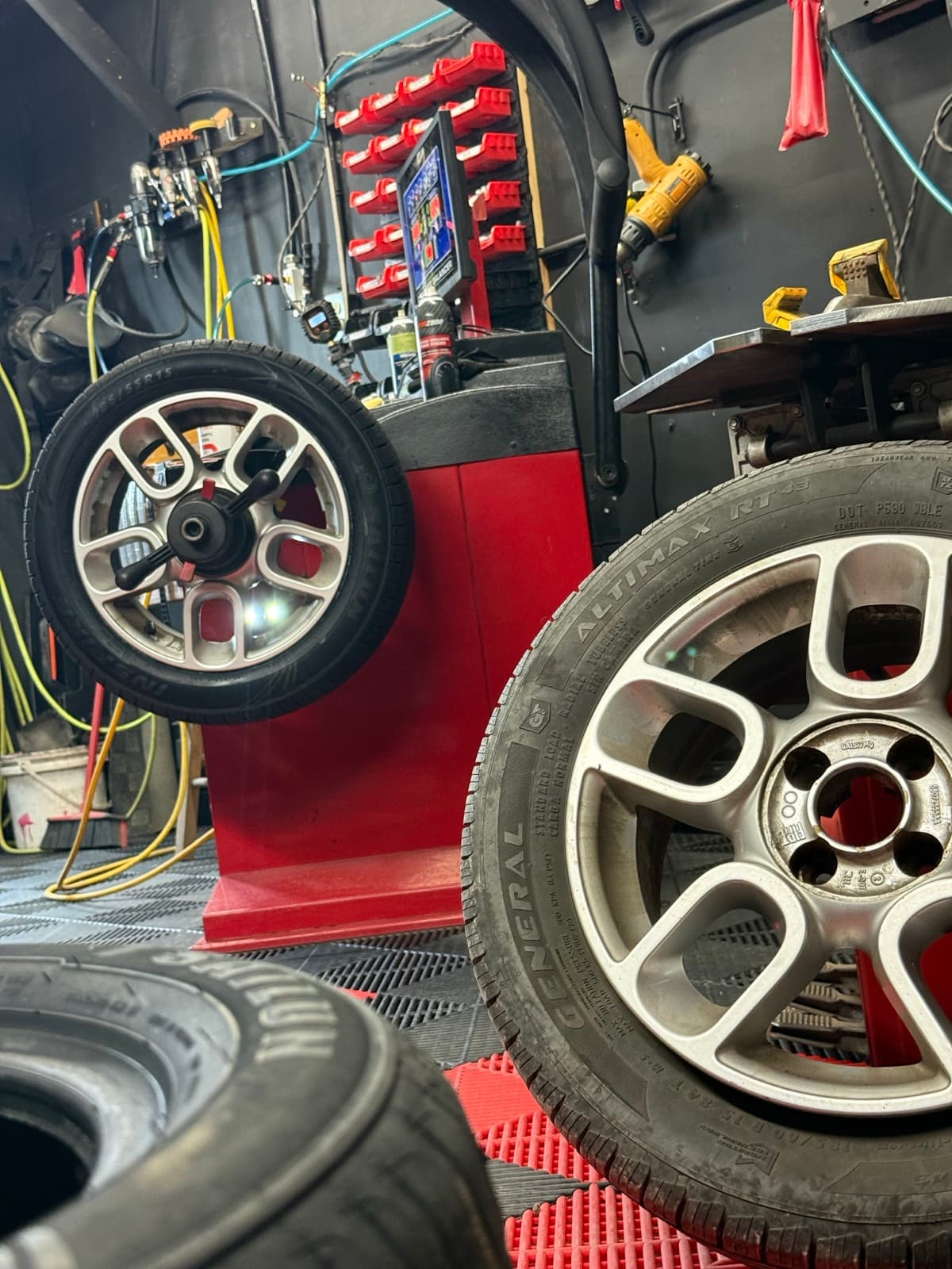 Two freshly mounted General Altimax tires side by side in the PitStop & Go bay