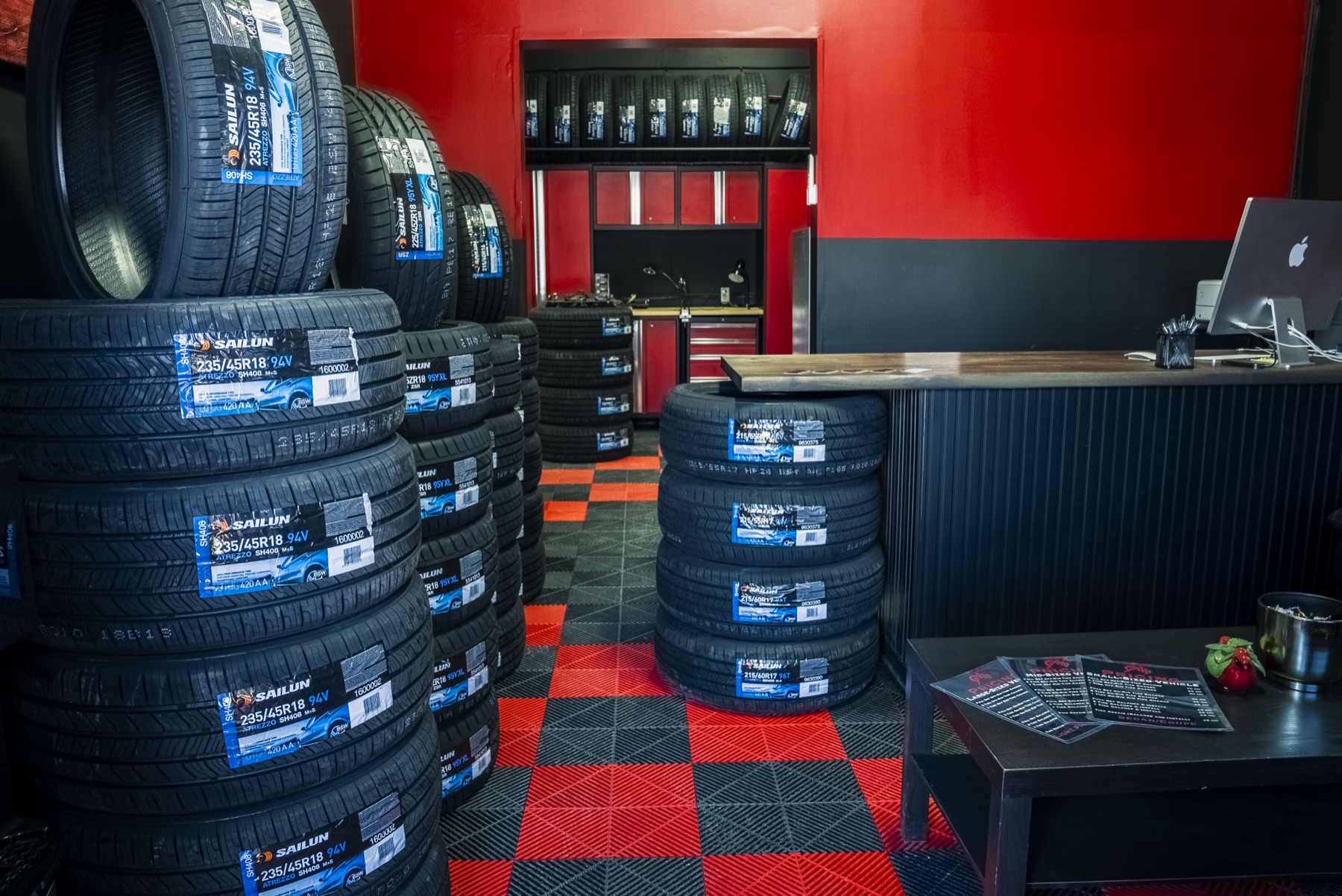 Stacks of new tires in the PitStop & Go showroom